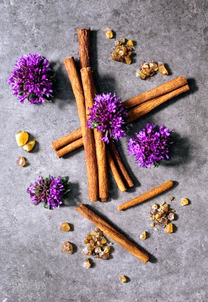 SE-LF Frankincense & Patchouli collection: Earthy frankincense resin and rich patchouli leaves resting on a polished concrete surface.