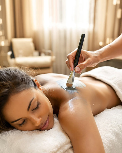 Professional Body Wraps by SE-LF | A woman is having French Clay Mud applied to to her shoulder