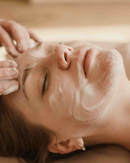 SE-LF Bespoke Facials | A woman has her face cleansed
