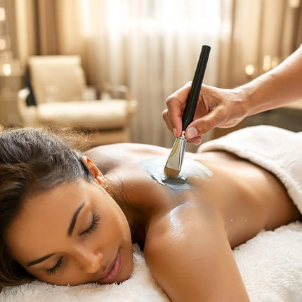 Professional Body Wraps by SE-LF | A woman is having French Clay Mud applied to to her shoulder