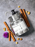 SE-LF Massage Oil | An eco-friendly reusable metal container with a pump sits besides a pool